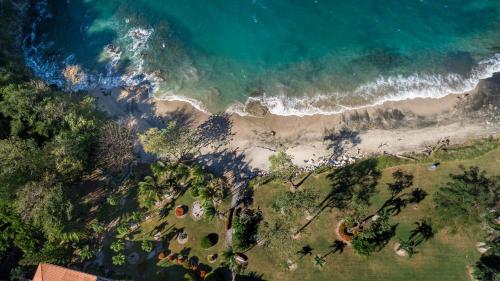 an aerial view of a beach and the ocean at Flamingo Marina Cove 617- Oceanfront 3 Bedroom Condo in Playa Flamingo