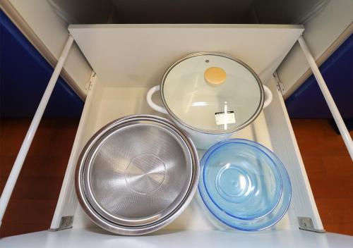 a box with two plates and a mirror in it at 茂平の宿 in Yoro