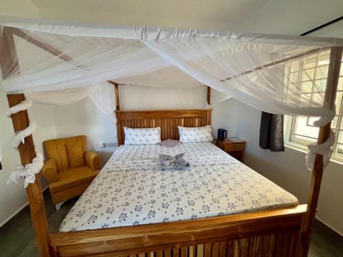 Postel nebo postele na pokoji v ubytování ZMK Hotel