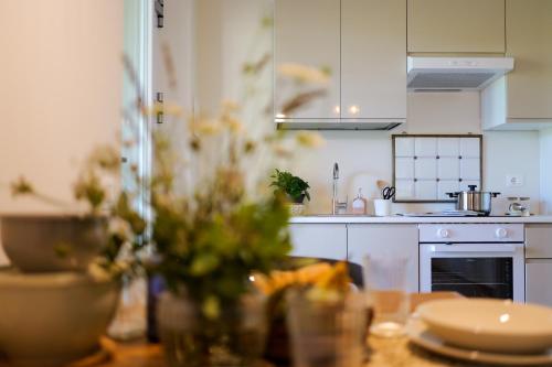 a kitchen with a table with a counter top at Oltrebosco Casa Vacanze in Valfabbrica