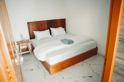 Postel nebo postele na pokoji v ubytování Kuma Surf House