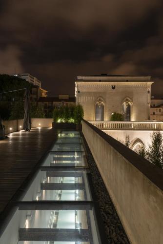a view from the roof of a building at night at Villa Boscarino Boutique Hotel & Spa in Ragusa