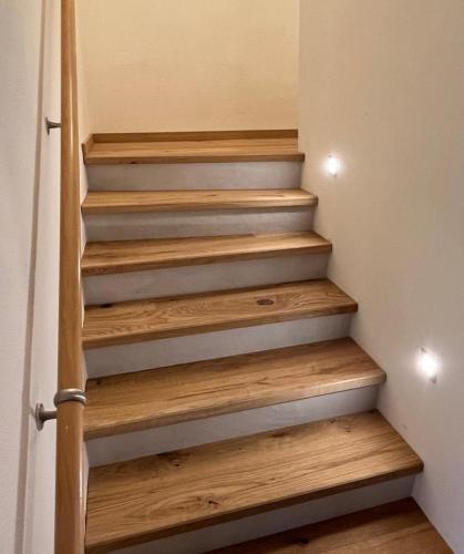 a staircase in a house with wooden steps at Ferienhaus Der Musikus in Kleinarl