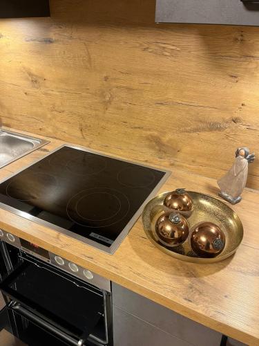 a counter top with a bowl of silver balls on it at Ferienhaus Der Musikus in Kleinarl