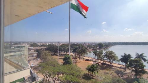 a view of a river with a flag on a building at Mayur Belgaum Presidency Hotel & Spa in Belgaum