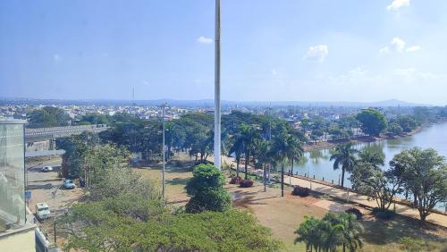 a view of a river with trees and a city at Mayur Belgaum Presidency Hotel & Spa in Belgaum