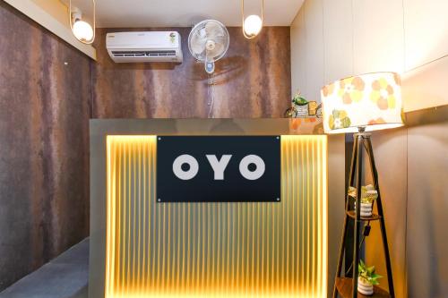 a room with an ovo sign on a wall at Hotel O BIJAY HOMES in Bhubaneshwar