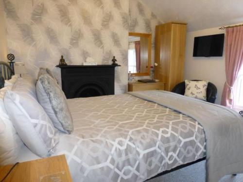 Ένα ή περισσότερα κρεβάτια σε δωμάτιο στο Bryn Derwen Guest House
