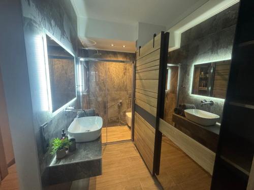 a bathroom with two sinks and a toilet at Apartimo B2 in Alexandroupoli