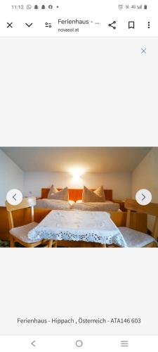 a bedroom with two beds with a light on top at Urlaub am Antritthof in Grün