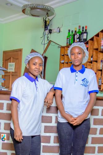 two young boys standing next to each other at RESIDENCE HOTEL Moungali in Brazzaville
