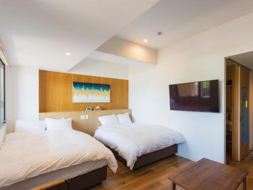 Fukiagehama Field Hotelにあるベッド