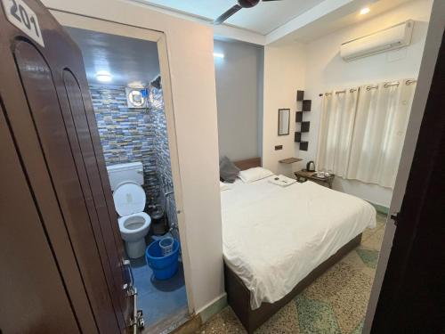 Cama o camas de una habitación en Ganga Guest House