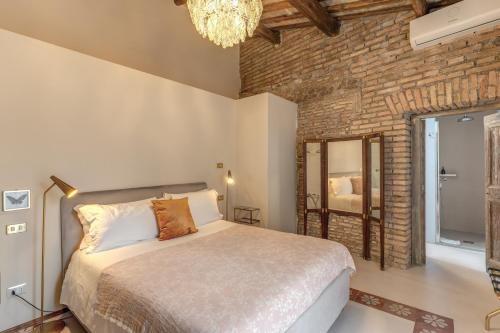 Residenza Brama - Art ApartHotelにあるベッド