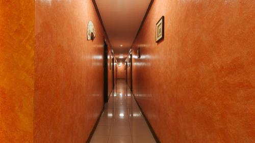 a long hallway with at Peace Hotel by RedDoorz in Manila