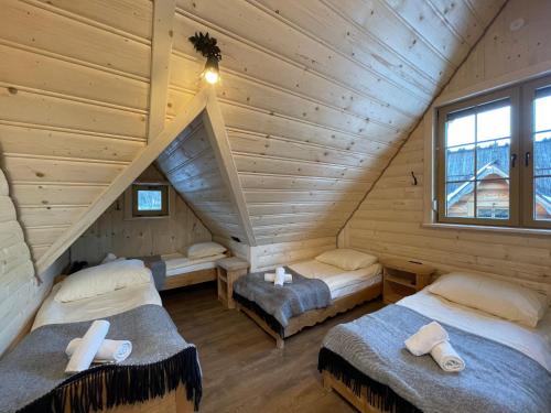 Postel nebo postele na pokoji v ubytování Śwarna Kolibecka