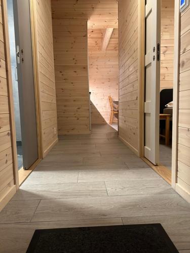 a hallway of a house with wooden walls at Haugo Utleige Lodge in Vossevangen