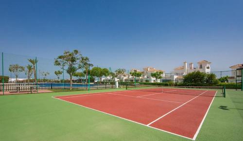 a tennis court with a net on top of it at Atico Miso in Torre-Pacheco