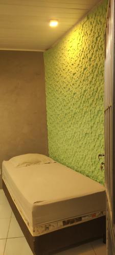 Ένα ή περισσότερα κρεβάτια σε δωμάτιο στο Suíte Maria bonita