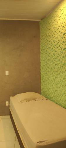 Ένα ή περισσότερα κρεβάτια σε δωμάτιο στο Suíte Maria bonita