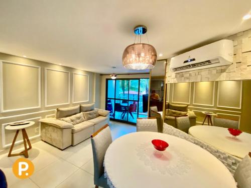 a living room with two tables and a couch at Luxor Paulo Miranda Home Service in João Pessoa