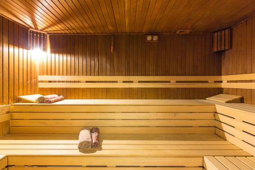 a woman is laying in a sauna at Vicenza Hotel Istanbul Old City in Istanbul