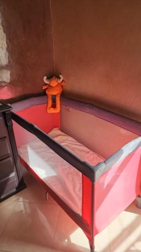 a bunk bed with a toy animal on top of it at Dar mayssane in Agadir