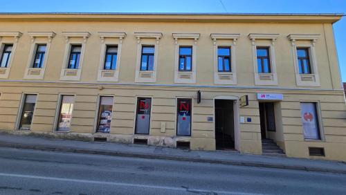 a building on the side of a street at Apartment Lovro in Ivanec