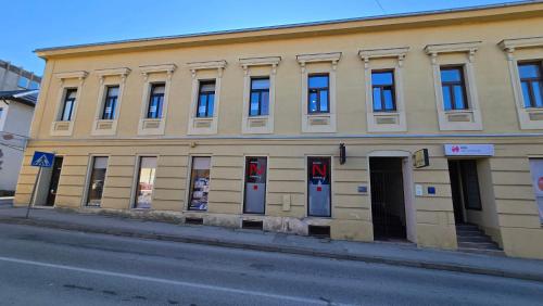 a building on the side of a street at Apartment Lovro in Ivanec