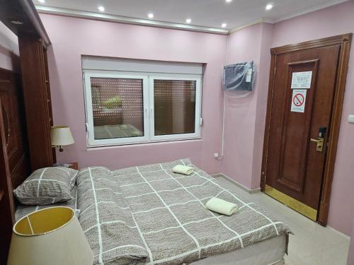 Ένα ή περισσότερα κρεβάτια σε δωμάτιο στο Vila Lavita 24