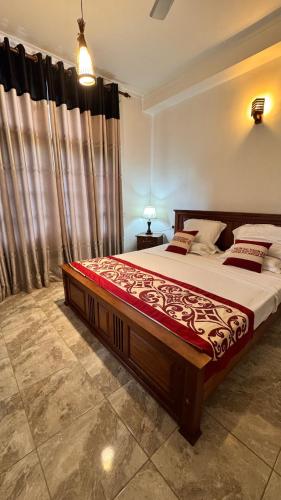 a bedroom with a large bed in a room at T51 Hanthane in Kandy