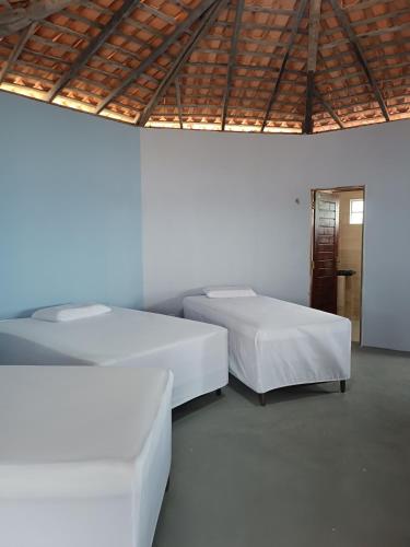 Postel nebo postele na pokoji v ubytování Cabanas del Mar pousada