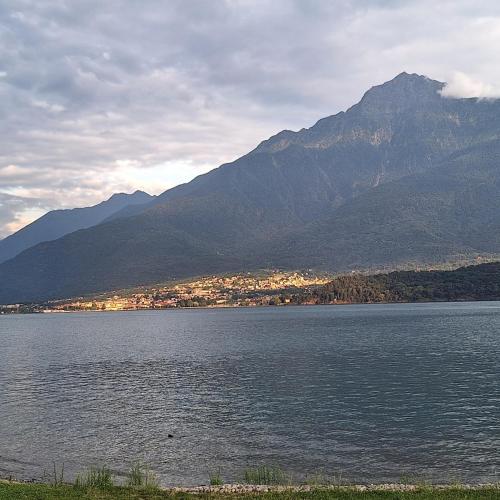 a large body of water with mountains in the background at Villa Viva-Como in Domaso