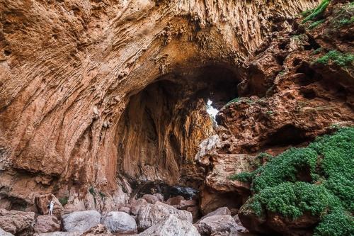 a cave in the side of a cliff at apartment for guests in Demnat