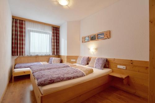 Posteľ alebo postele v izbe v ubytovaní Apart Tiefenbach