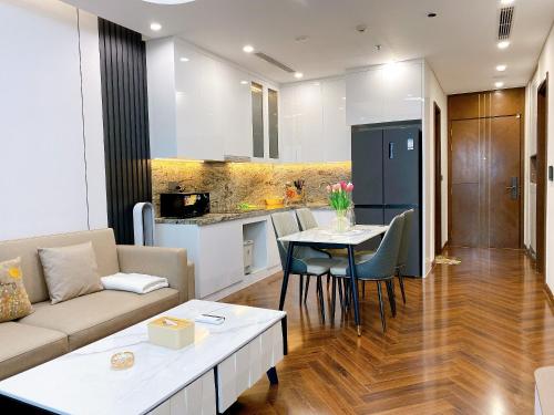 a living room and kitchen with a couch and a table at Two bedrooms Apartment in Diamond Crown Hai Phong 2522 in Ðông Khê