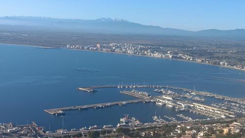 an aerial view of a marina in a large body of water at Los Angeles in Roses