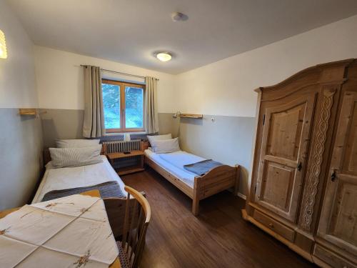 Postel nebo postele na pokoji v ubytování Haus Auracher