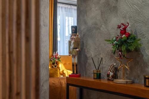 a room with a table with christmas decorations on it at Dream Holiday z Sauna i jacuzzi Lovely Krynica Zdrój in Florynka