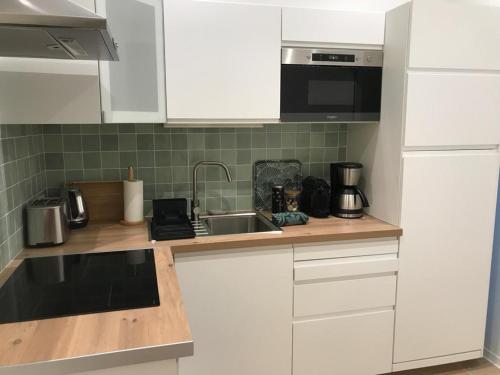 Η κουζίνα ή μικρή κουζίνα στο Aquitain Home chambre studio appartement Gare Saint Jean