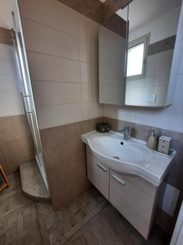 a bathroom with a sink and a shower at I 4 Leoni in Conversano