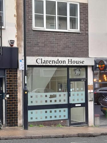 a store front of a carleton house on a city street at Flat in Northampton -Town Center in Northampton