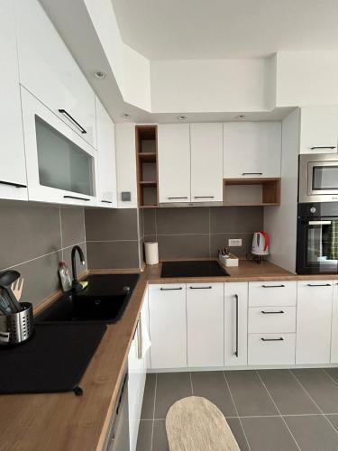 Kuchyňa alebo kuchynka v ubytovaní Mina Residence