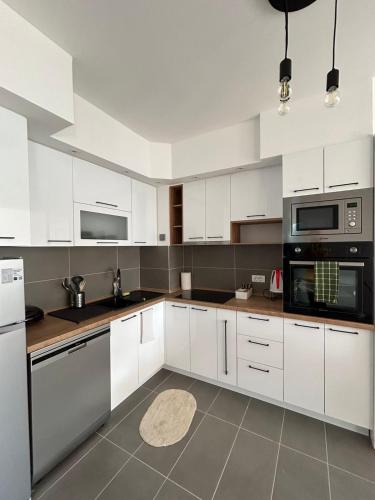 Kuchyň nebo kuchyňský kout v ubytování Mina Residence