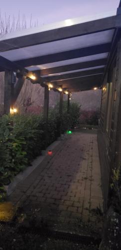a lit up walkway under an overpass at night at Chalet 176, Durbuy PROMO in Durbuy