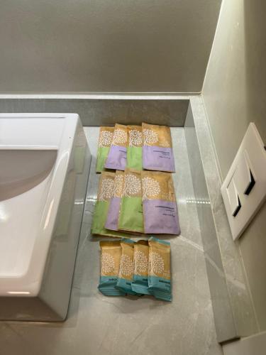 three packages of cheese in a display case in a refrigerator at Studio no Centro de Floripa 200m da Beira Mar in Florianópolis