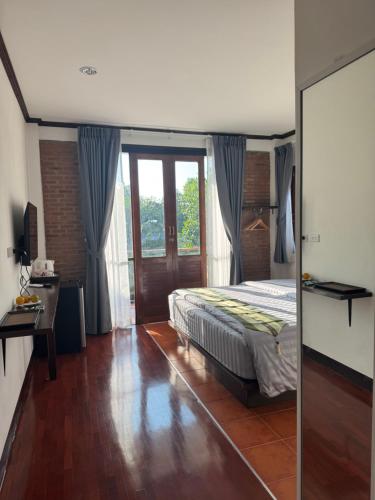 Postel nebo postele na pokoji v ubytování Proud Chiang Mai Poshtel