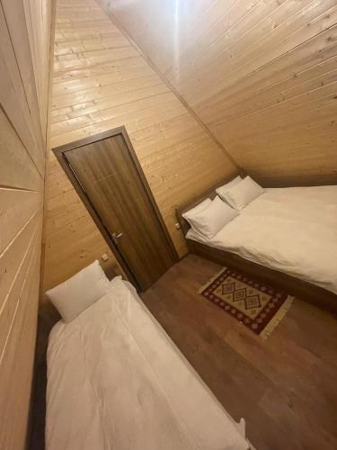 an overhead view of two beds in a small room at Chalet Gudauri in Gudauri