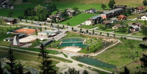 an aerial view of a small town with a park at Mölltaler Ferienhäuser in Großkirchheim