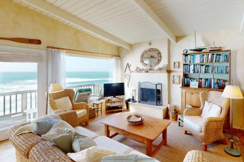a living room with a view of the ocean at Oceanfront Dream in Cayucos